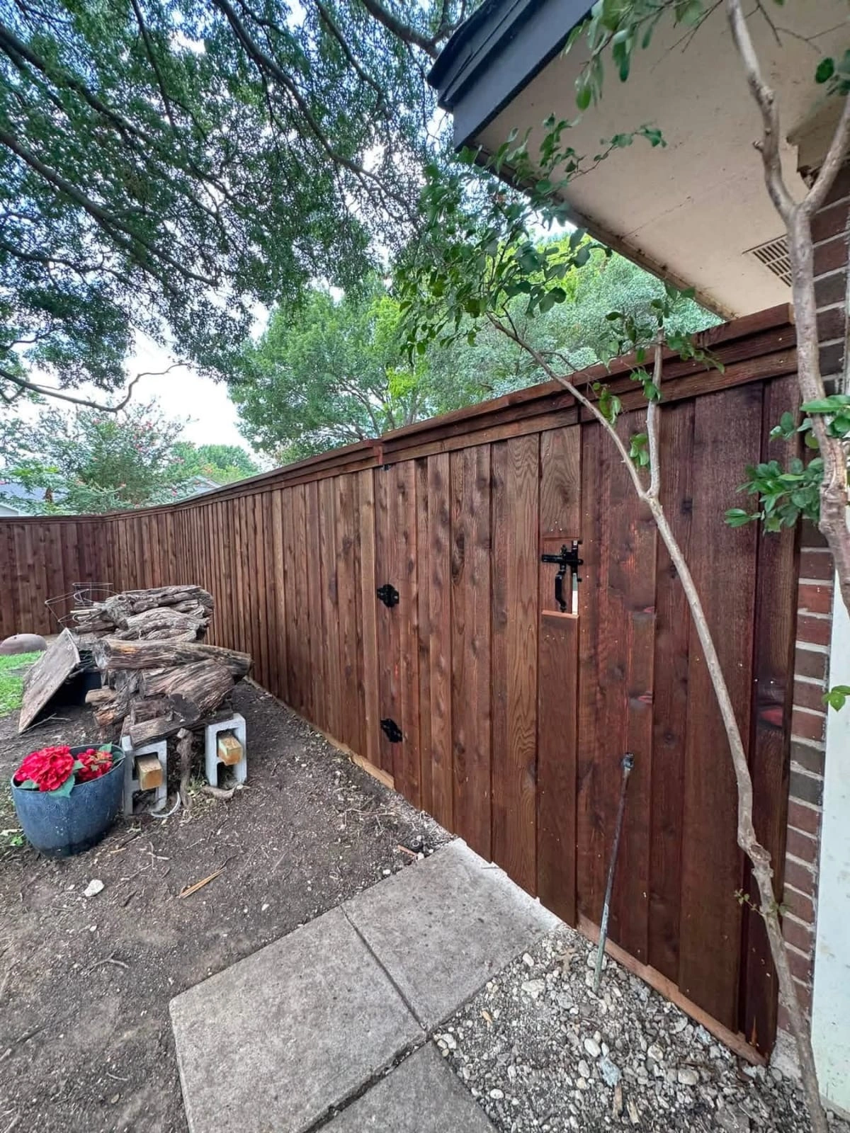 Wood fence project beside a home